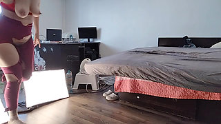 Amateur wife dancing naked at home. Amateur woman has fun trying on clothes and cutting them.