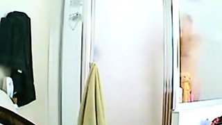 Hidden spy camera captures hot stepmom taking a shower