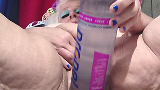 Big Bottle Plugged Clit Cunt