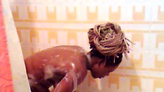 Nathalie  Loulendo in bathroom