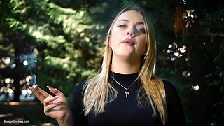 Hot Blonde Babe Smoking One Black Cigarettes in Nature
