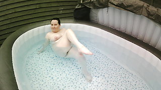 Brunette Wife with big breasts Naked in the Hot Tub