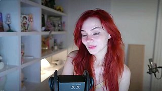 Redheaded pierced teen close up toy show