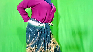 An Indian beauty masturbating while wearing a saree, clear Hindi