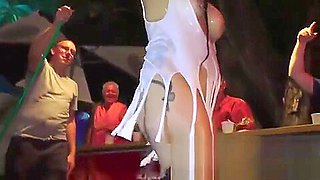 Slutty pierced girl stoves a bottle up pussy at fantasy fest