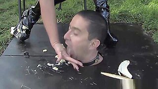 Busty bdsm femdoms sub eats food of her boots