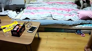 Cute amateur asian web cam girl playing with her toy