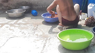In the country&#039;s bathroom of the village, the elder sister-in-law&#039;s stepsister is soaking her saree in water and bathi