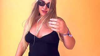 Teasing You with My Tanned Cleavage in a Black Dress