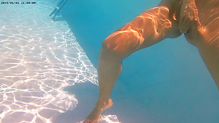 Ehibitionist nudist girl in public swimming