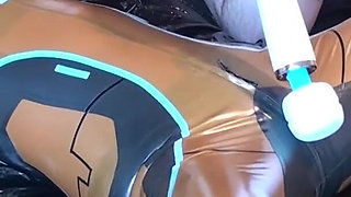 Latex Danielle is attached to the bed and masturbated with the massage vibrator