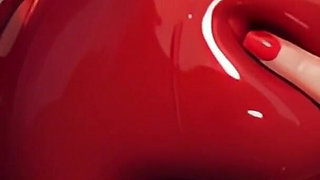 Watch Ai Amber Happily Play with Her Cum-filled Latex Tits