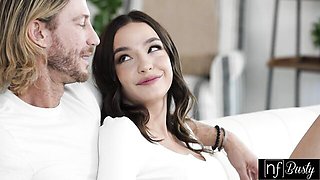 Rissa May rides reverse cowgirl on the white sofa with open kitchen behind