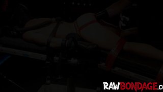 Chained jock lying face down being fisted in his ass