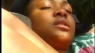 Ebony slut wraps her lips and pussy around white cock by the pool