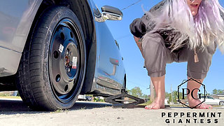 67 Tall Amazon Goddess Changes Her Tire - Big Feet in Frame