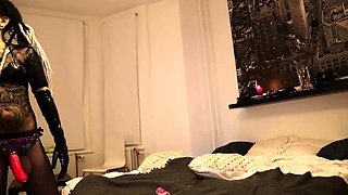 Femdom milf vixen subjects her slave to strapon domination