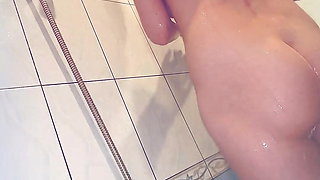 My step sis takin a shower and I film her big nipples  and jerk off