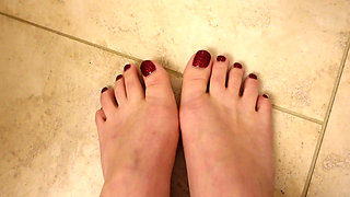 Quick New Pedicure Show off Glittery Red Toenails