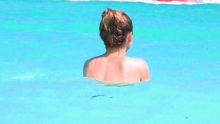 Smoothest nudist play in the warm water  at a nudist beach