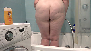 A Bathroom Camera Watches a Mature Wife. a Busty MILF Shaves Her Legs. PAWG.