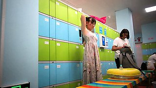 Cute amateur asian web cam girl playing with her toy