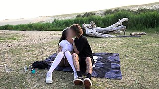 Young couple fucks on the beach until it gets dark.