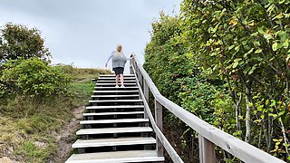 Blonde is flashing her big boobs in the outdoors