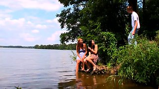 Lovely young babes having outdoor threeway fun with a friend