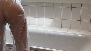 Sue, Cleaning the Bathroom in a Pvc Suit!