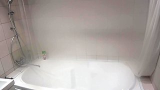 Teen in the bathtub relishing a long steam shower