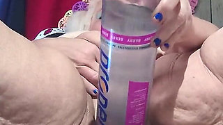 Big Bottle Plugged Clit Cunt