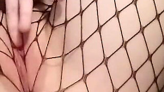 Masturbating My Pussy in Fishnet Tights with My Legs Spread