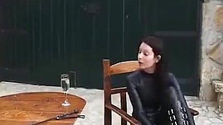 Blackhaired Domina in Latex Pissed Man in Mouth, Then He Licks Her After He Is Fucked Hard with a Strapon and Eats His Own Cum