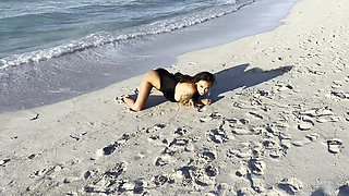 Sexy Monika Fox in Black Bodysuit on Beach