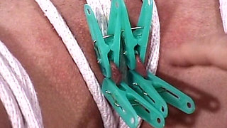 Fat Ass Brunette Gets Tied up and Her Pussy Lips in Hairpins