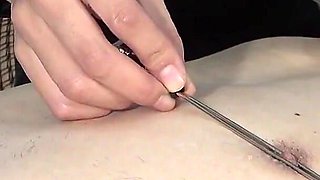 A Sadistic Female Doctor Inserts a Bougie Into the Patient's Urethra and Gives Him an Electric Shock, Laughing