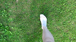 Socks Removal and Walk Barefoot on the Grass