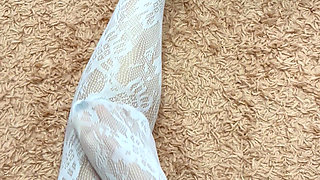 Rubbing my slim legs in hot stocking and heels