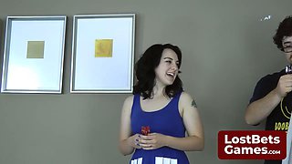 Tattooed Brunette Plays Strip Darts with Foot Fetish