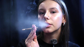 Young Girl Smoking Solo in a Calm Studio Session with Slow Exhales