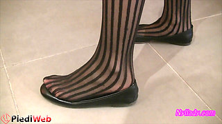 Nyllady Footplaying with a Phone Card in Patent Black Stockings