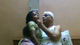 Slutty Indian maid gives head to old granddaddy with grey hair