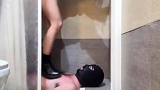 Amateur mistress peeing on masked slave in the shower