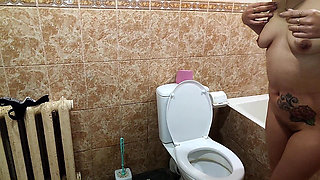 A Hot Brunette Pees in the Toilet