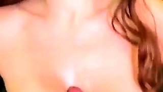 Busty redhead giving tittyfuck