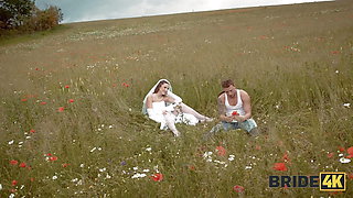 BRIDE4K. Pretty brunette bride fucks a horny shepherd in a summer field