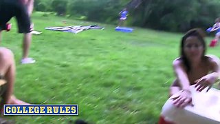 College students engage in wild outdoor game of kickball naked and wet with big boobs, trimmed pussy, and blowjob action.