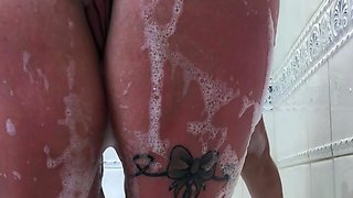 Busty curly brunette with big boobs fucks on couch