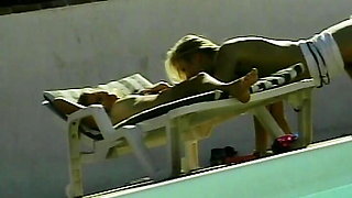 Attractive blonde dolls having lesbian fun by the pool